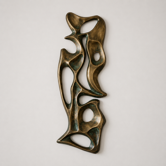 Bronze abstract sculpture on a light gray background