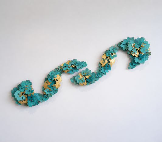 Teal and gold floral headband on a white background