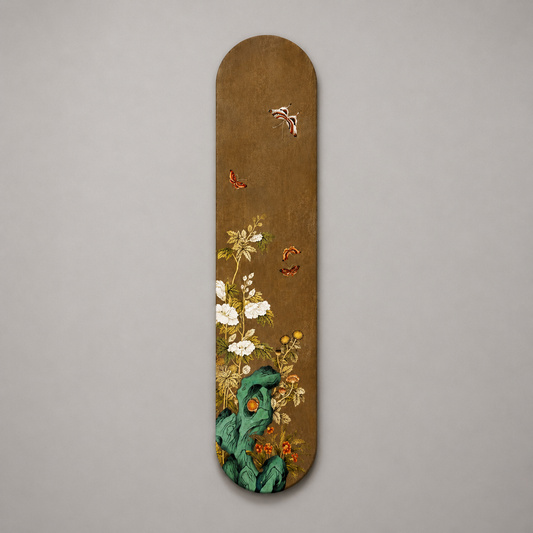 Decorative skateboard deck with floral and butterfly design on a gray background