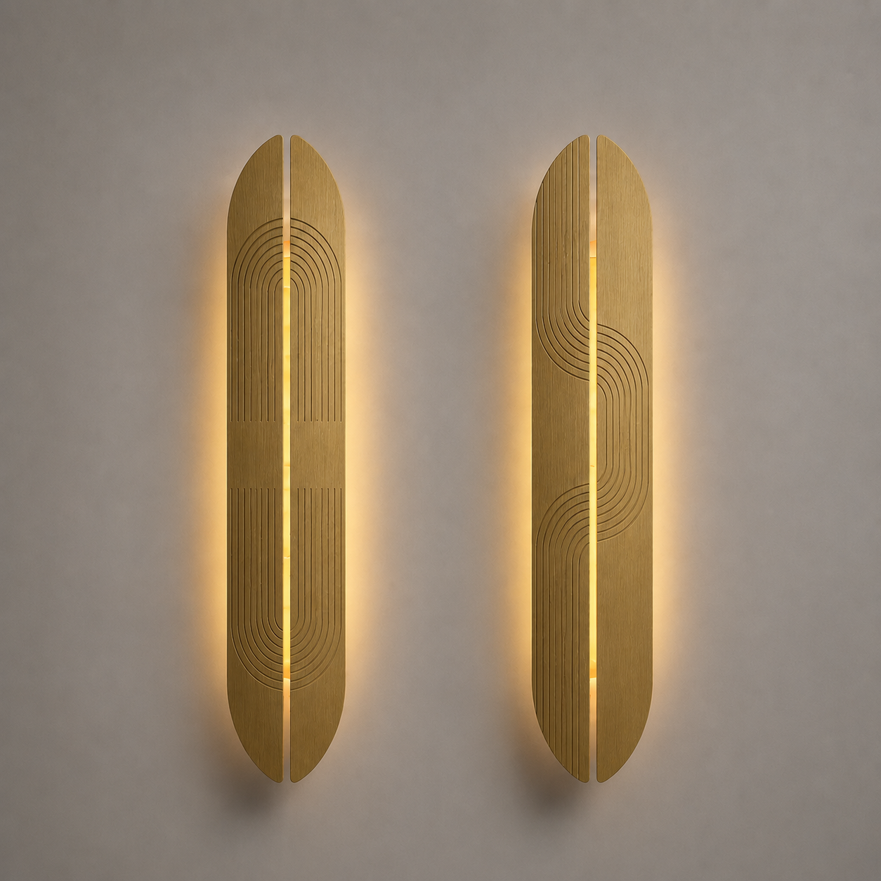 Two brass wall sconces with a geometric design on a gray wall.