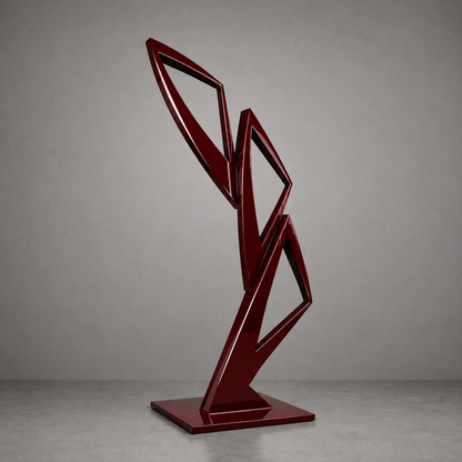 Red geometric sculpture on a gray background