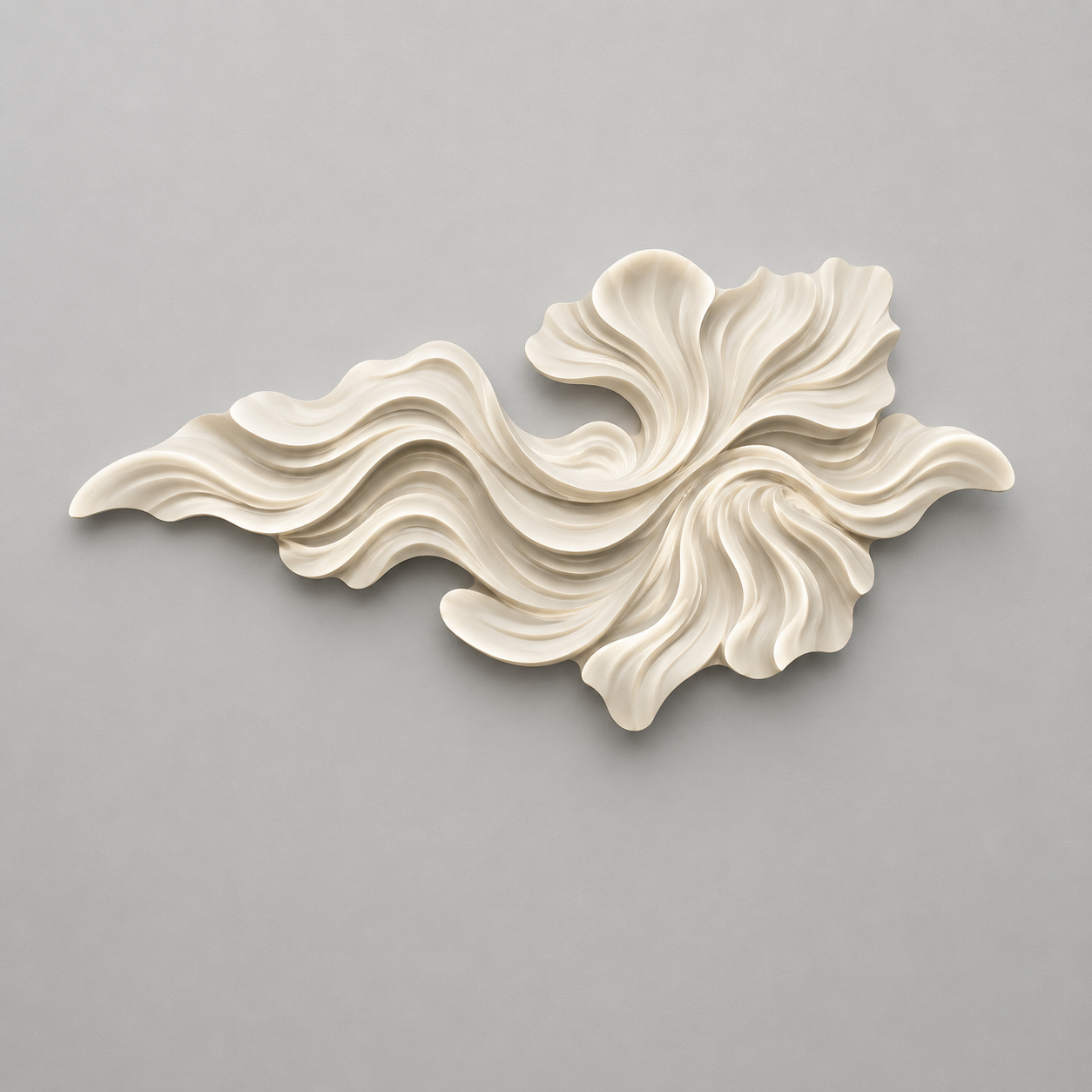Decorative wall piece with wavy, shell-like design on a gray background