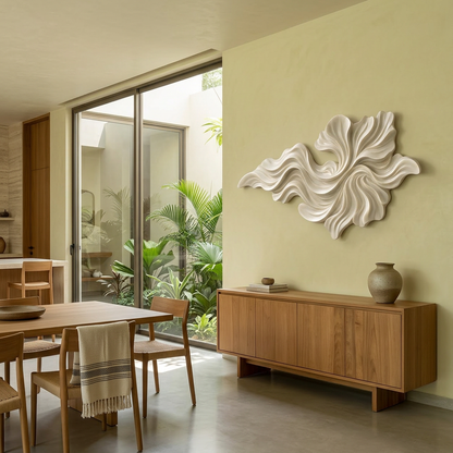 Dining room with wooden table, chairs, and a decorative wall piece.
